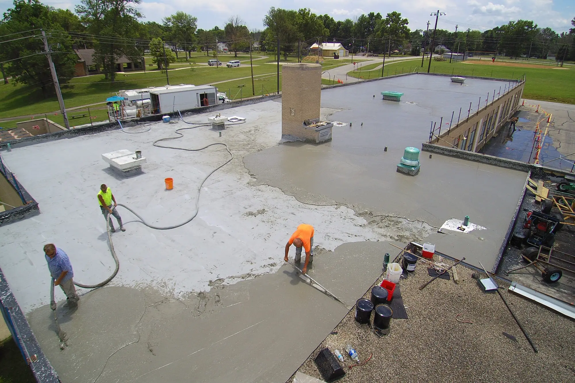 Elastizell Systems workers installing a lightweight insulating concrete roof deck for thermal efficiency and durability