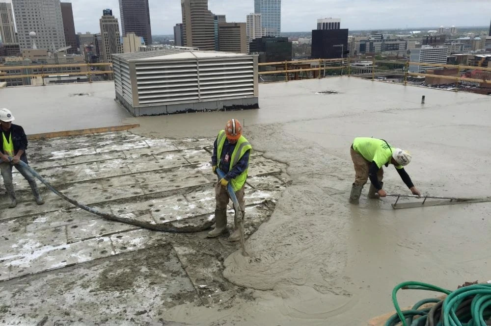 Elastizell Systems workers installing a lightweight concrete insulating roof deck